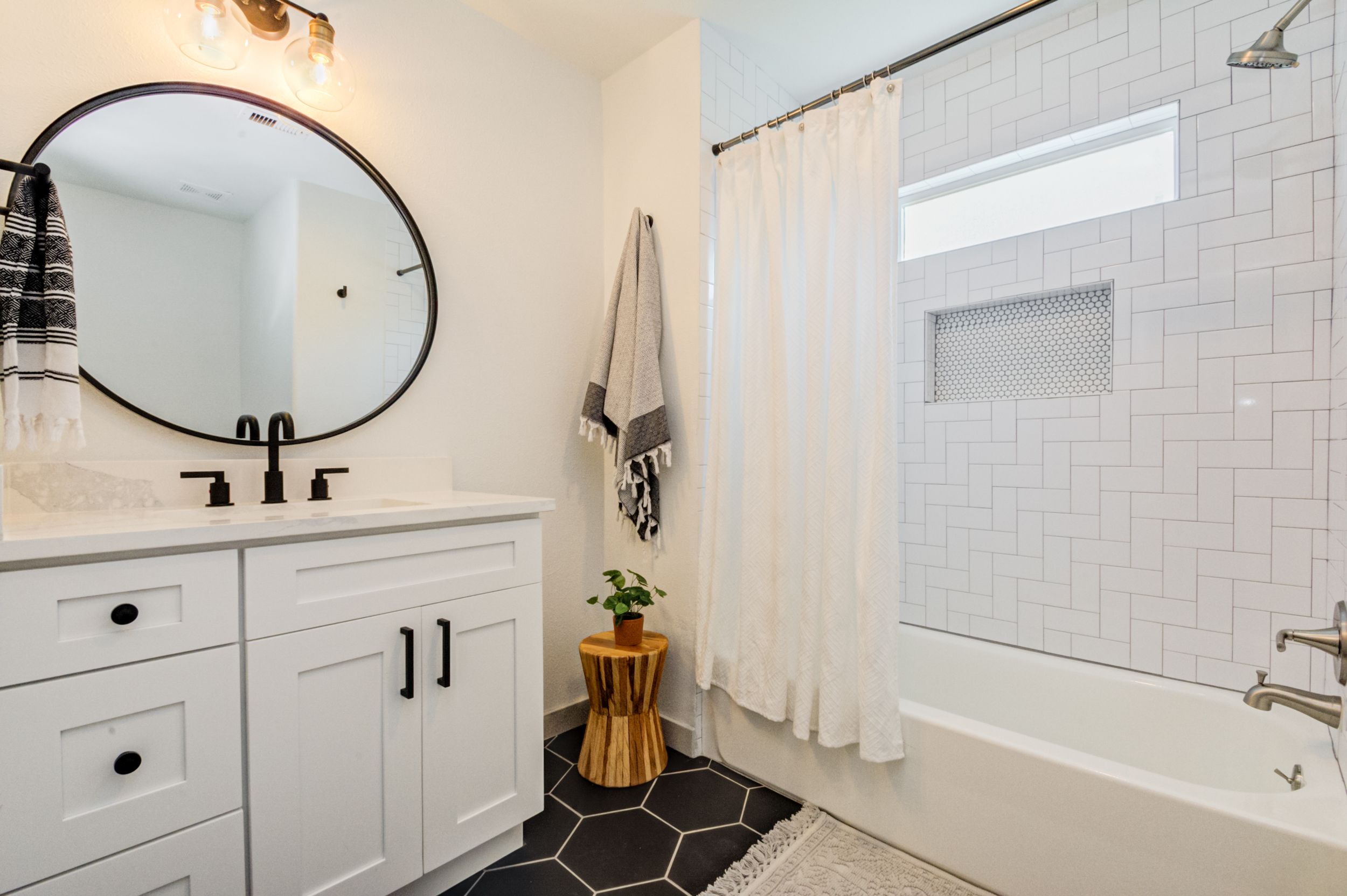 Guest Bath Black Hexagon Tile Round Mirror White Subway Tile Shower