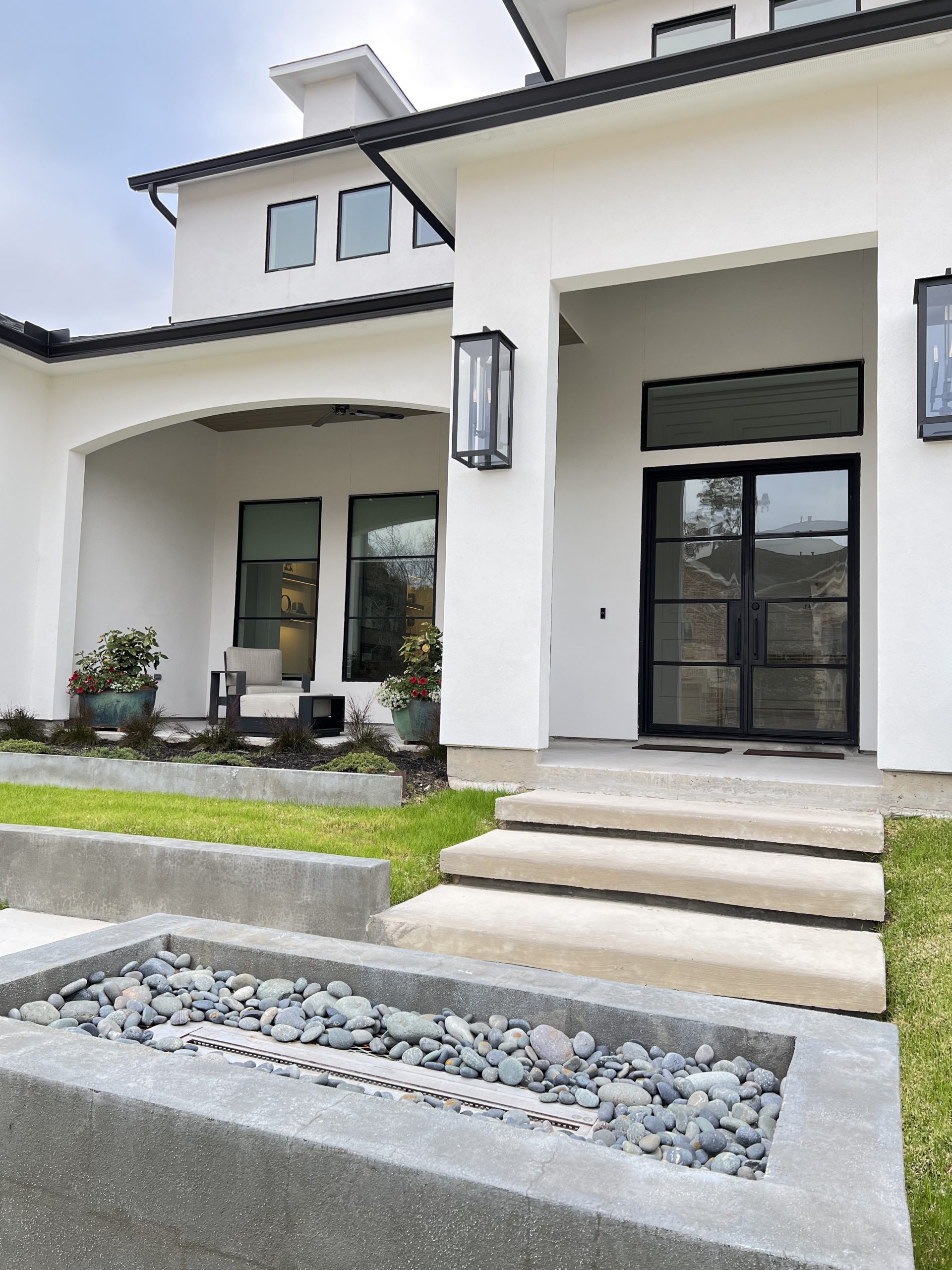 Home Exterior with White Stucco and Black Windows